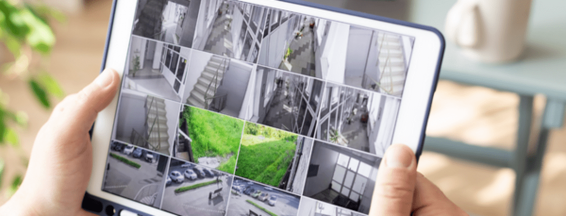 Employer looking at workplace CCTV on iPad